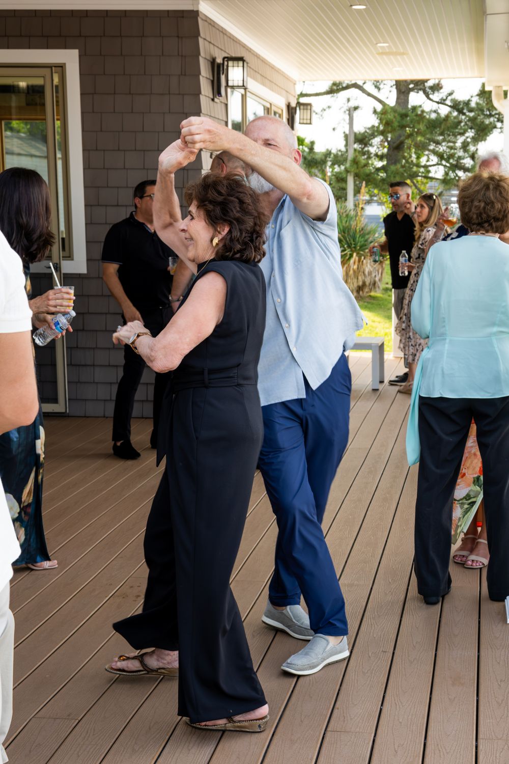 Guests dancing on a porch