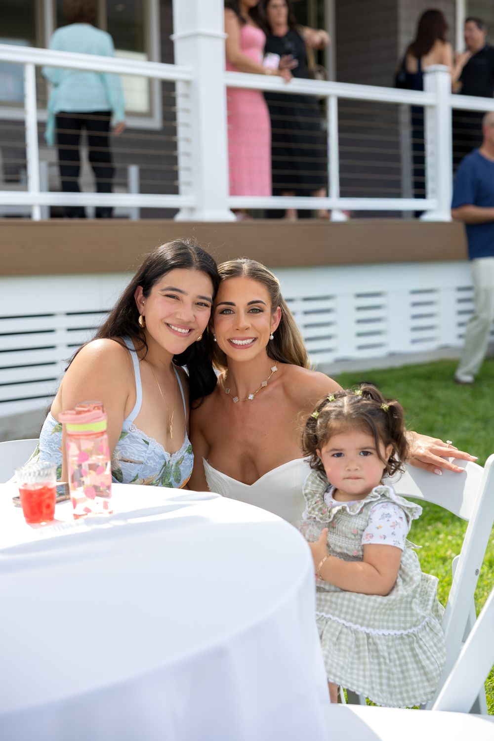 Guests at a table at a waterfront bridal shower