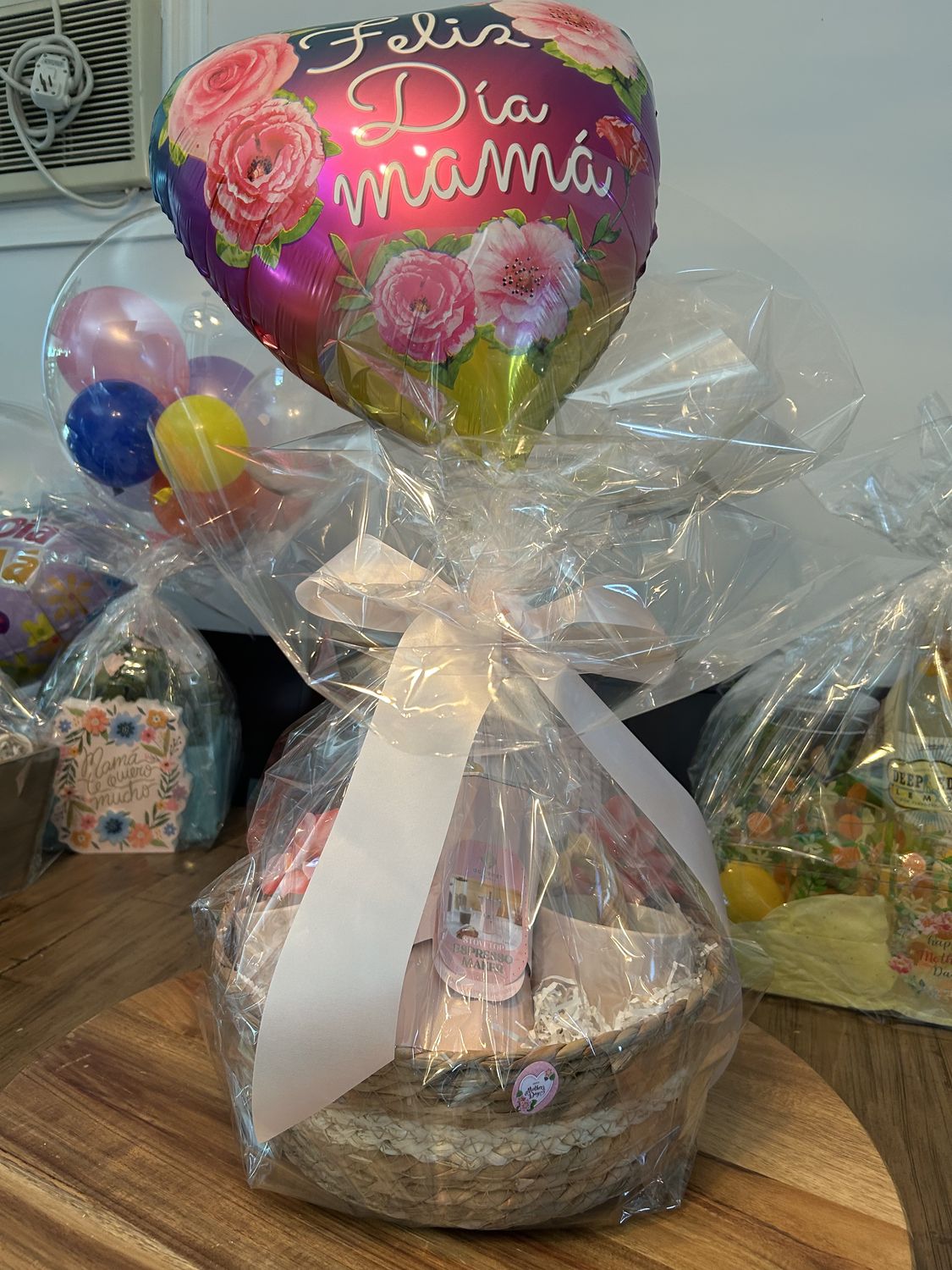 Wrapped gift basket with a heart-shaped balloon