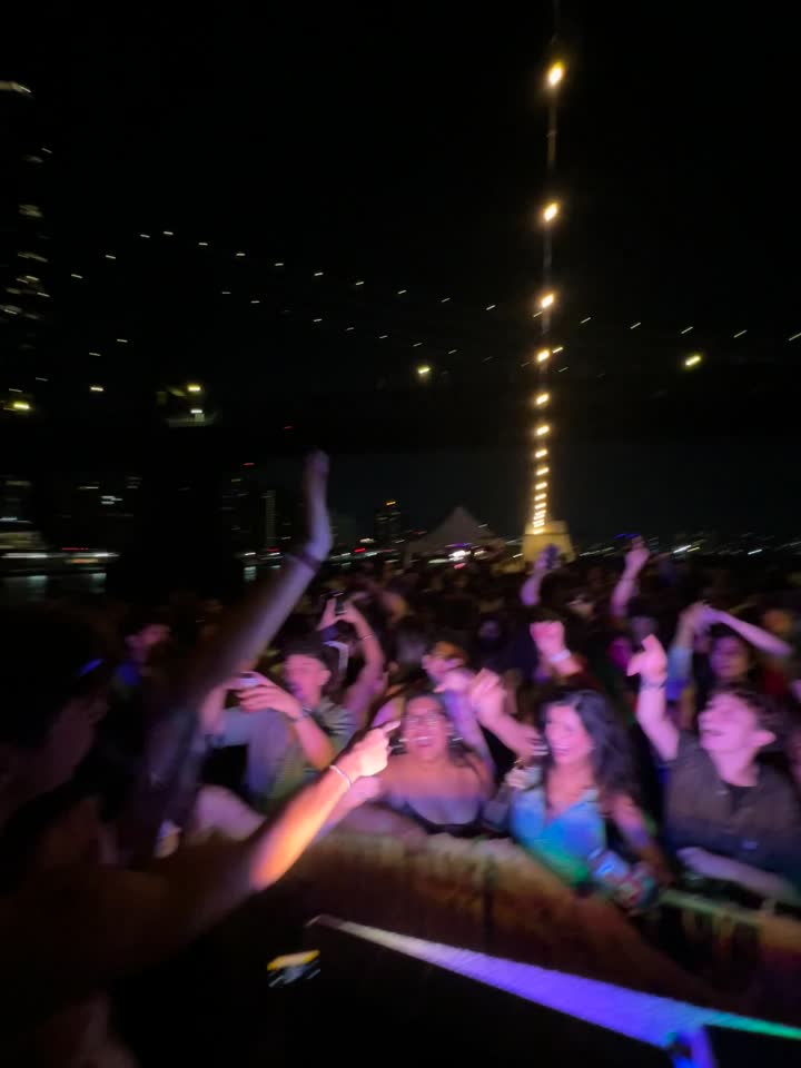 Crowd with hands up at a night event