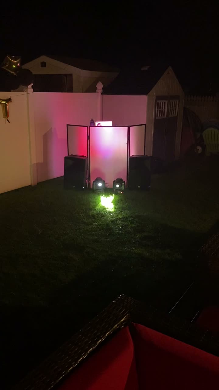 Backyard party with colored uplighting